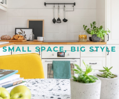 A bright and stylish small kitchen space featuring white cabinetry, wooden countertops, and a yellow chair, with the text ‘SMALL SPACE_BIG STYLE’ overlaid.