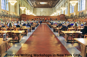 Interior of a grand library with rows of wooden tables and blue-shaded lamps, people reading, and a central aisle leading to a large window at the end.